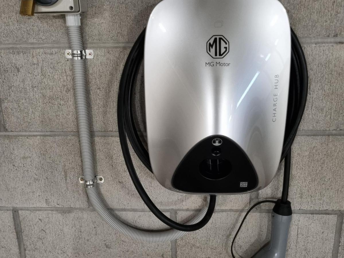 Sacred Waters Taupo Aparthotel Bagian luar foto MG Motor UK charging station