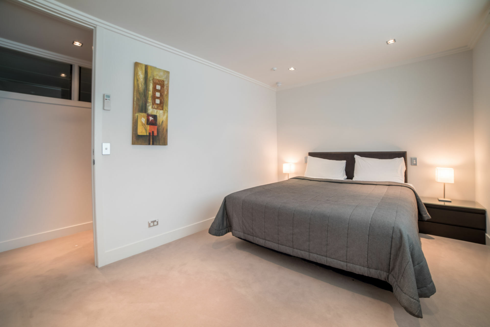 Sacred Waters Taupo Aparthotel Bagian luar foto A bedroom in a serviced apartment